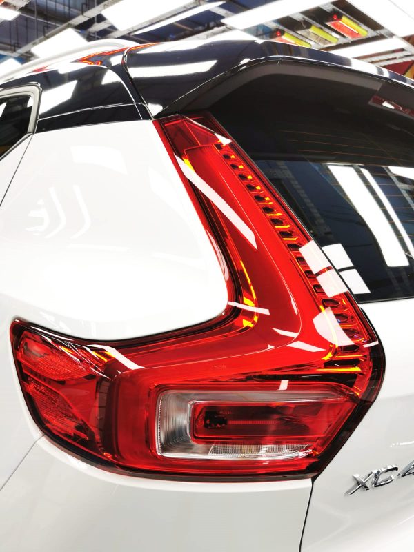 The coated bonnet of the Volvo XC40 under workshop lighting.