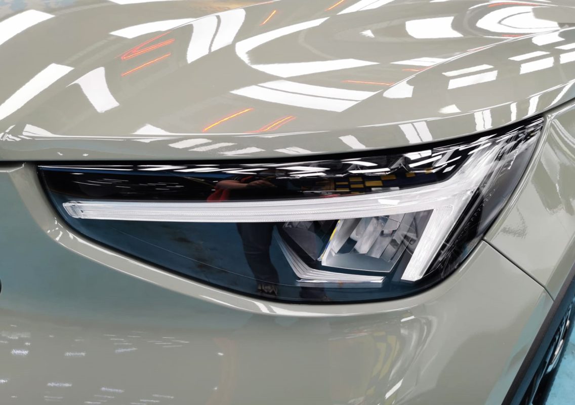 The XC40's coated paintwork showing clean reflections.