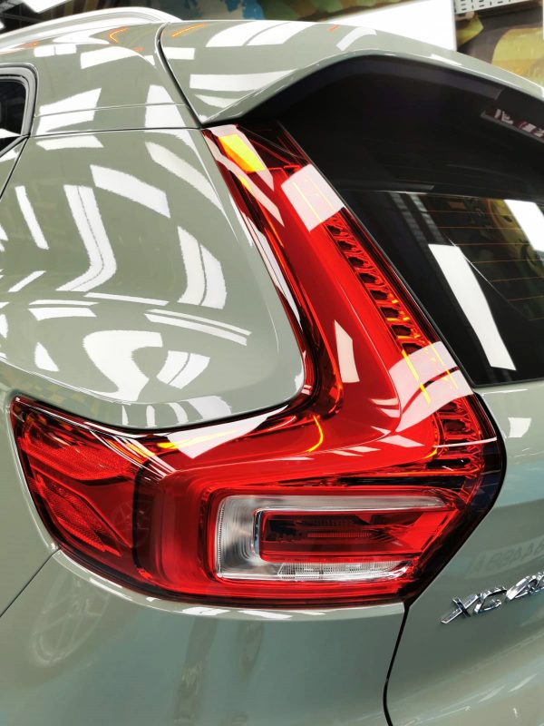 Coated bonnet of the Volvo XC40 under workshop lighting.