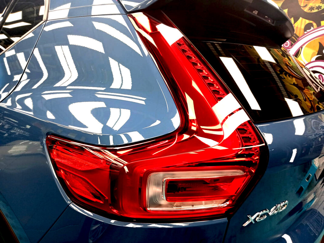 Coated bonnet of the Volvo XC40 under workshop lighting.