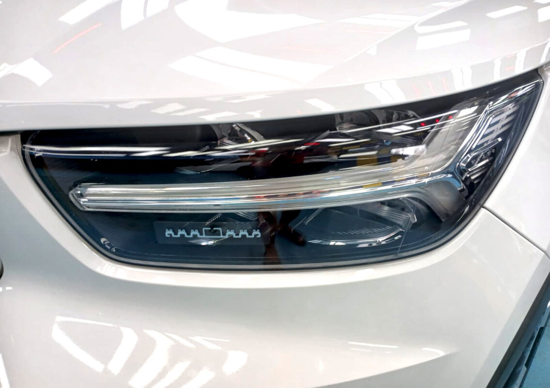 The XC40's coated paintwork showing clean reflections.
