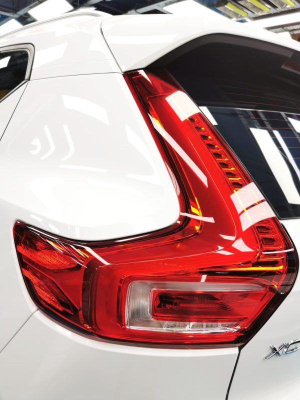 The coated bonnet of the XC40 under workshop lighting.