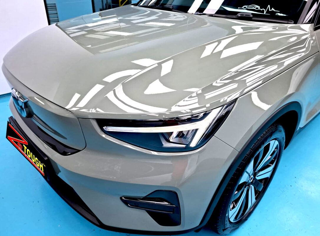 The Volvo XC40's coated paintwork under workshop lighting.