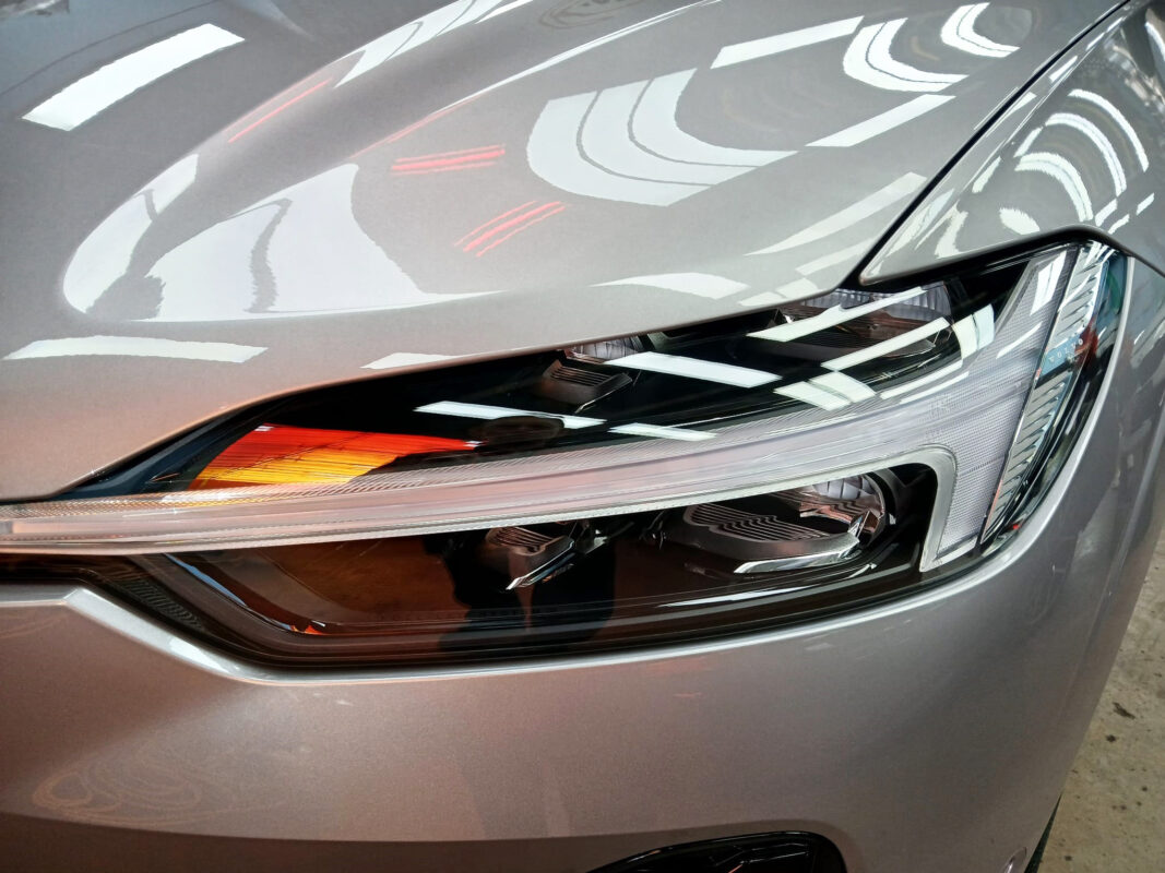 The XC60's coated paintwork showing clean reflections.