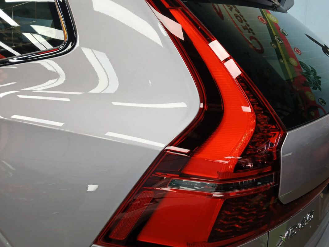 The coated bonnet of the Volvo XC60 under workshop lighting.