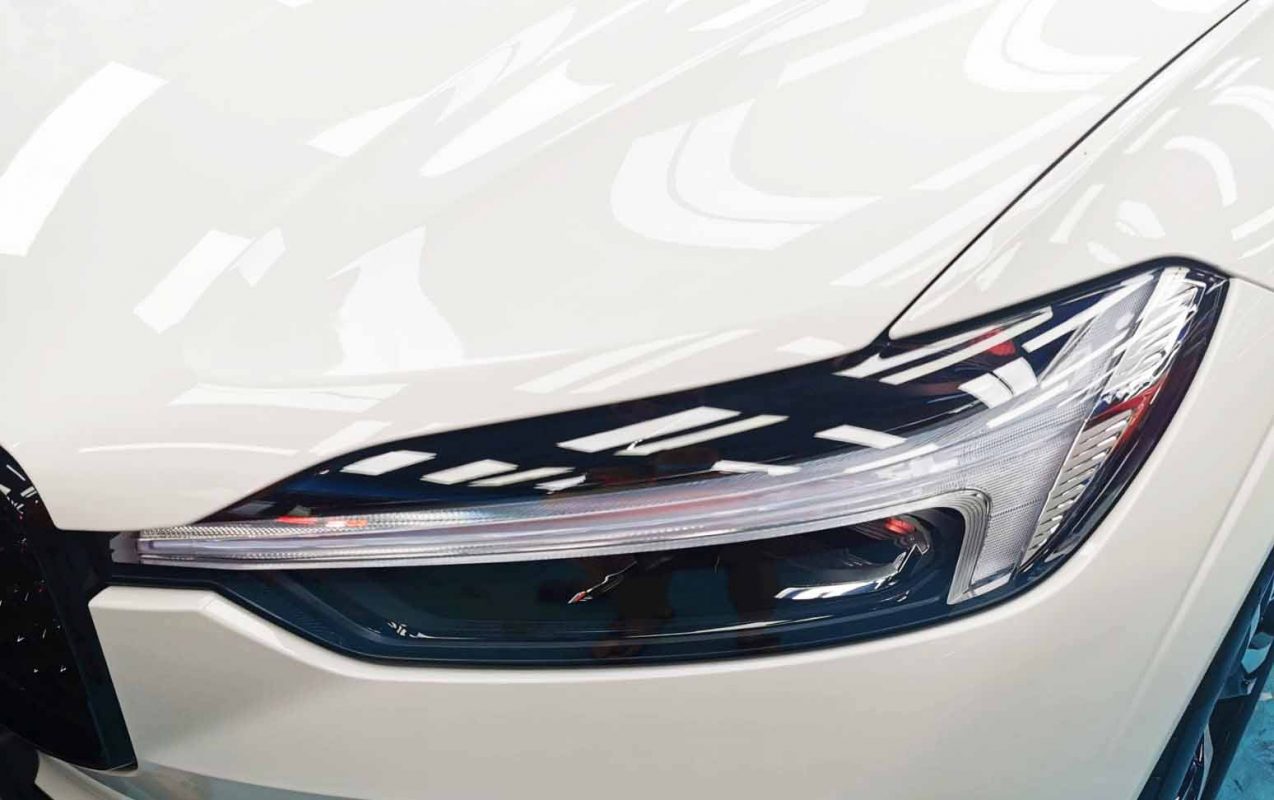 The XC60's coated paintwork showing clean reflections.