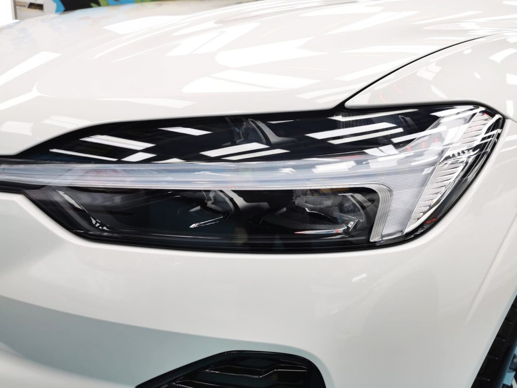 The XC60's coated paintwork showing clean reflections.