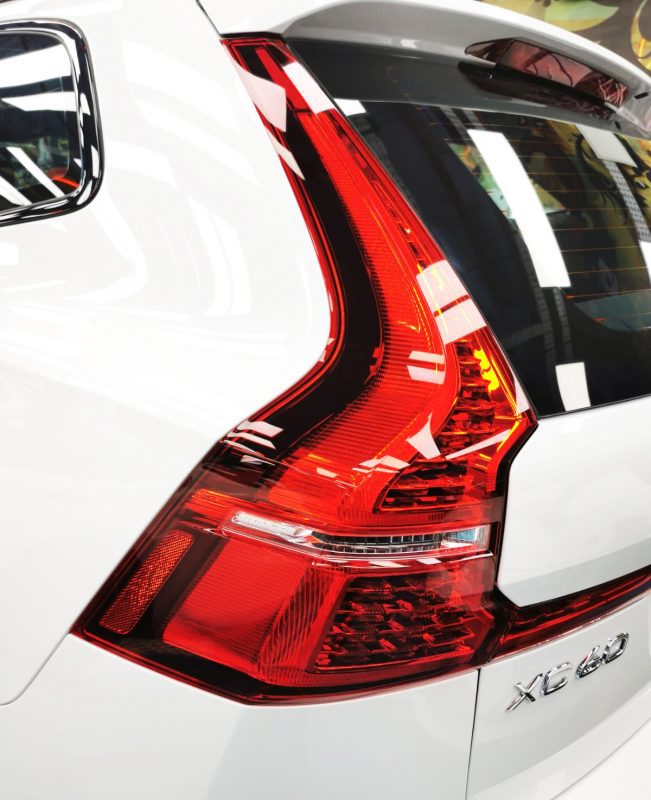 The coated bonnet of the Volvo XC60 under workshop lighting.