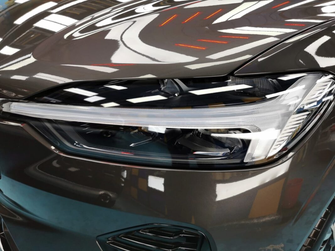 The XC60's coated paintwork showing clean reflections.