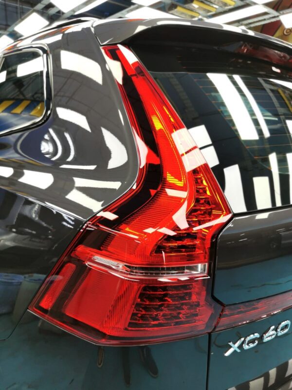 The coated bonnet of the Volvo XC60 under workshop lighting.