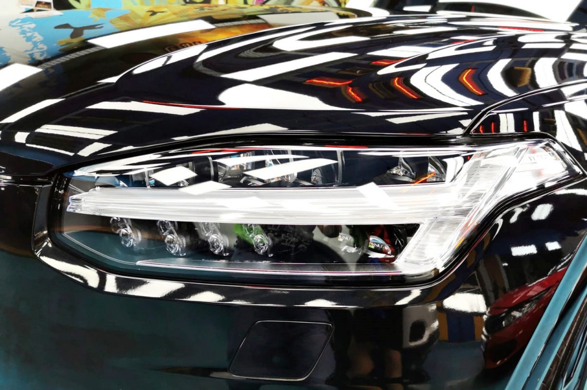 The XC90's coated paintwork showing clean reflections.