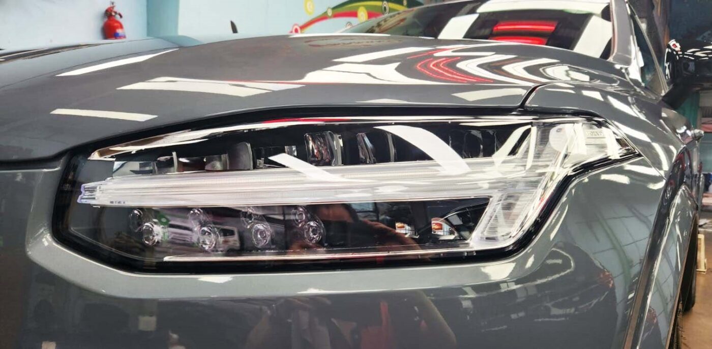 The XC90's coated paintwork showing clean reflections.