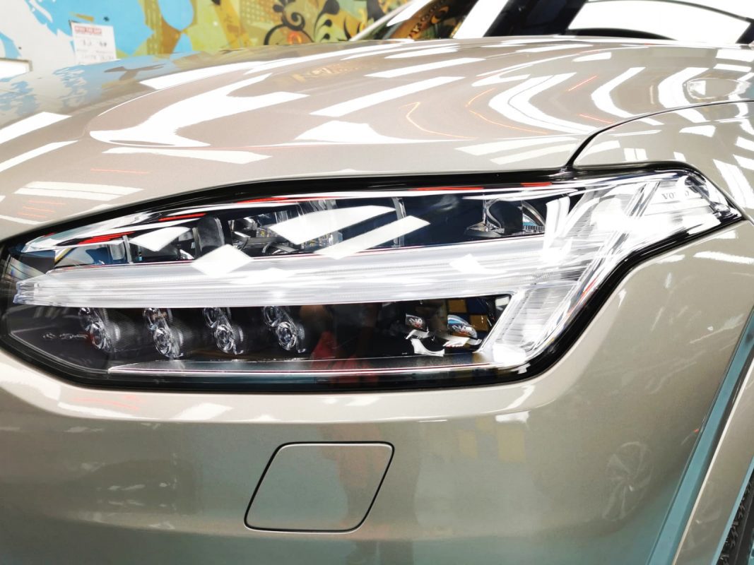 The XC90's coated paintwork showing clean reflections.