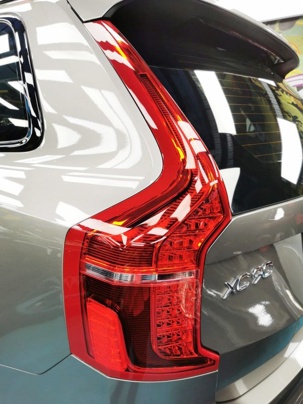 The coated bonnet of the Volvo XC90 under workshop lighting.