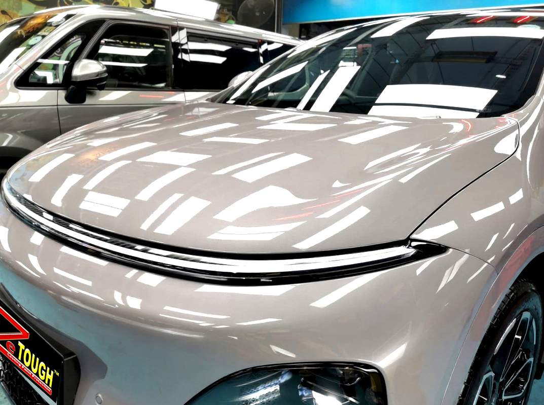 The XPeng G6 from a side angle after the ceramic coating.
