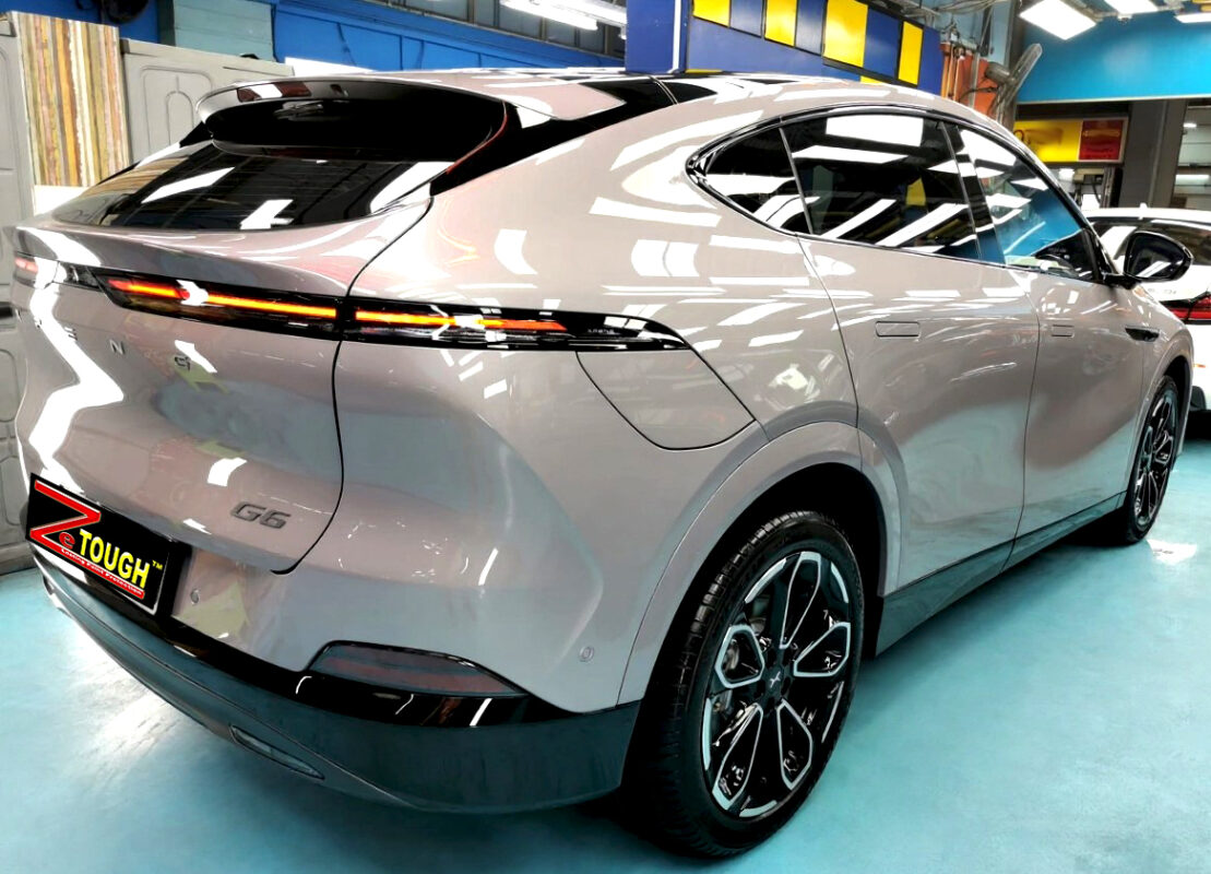 Rear quarter of the XPeng G6, glossy and protected.