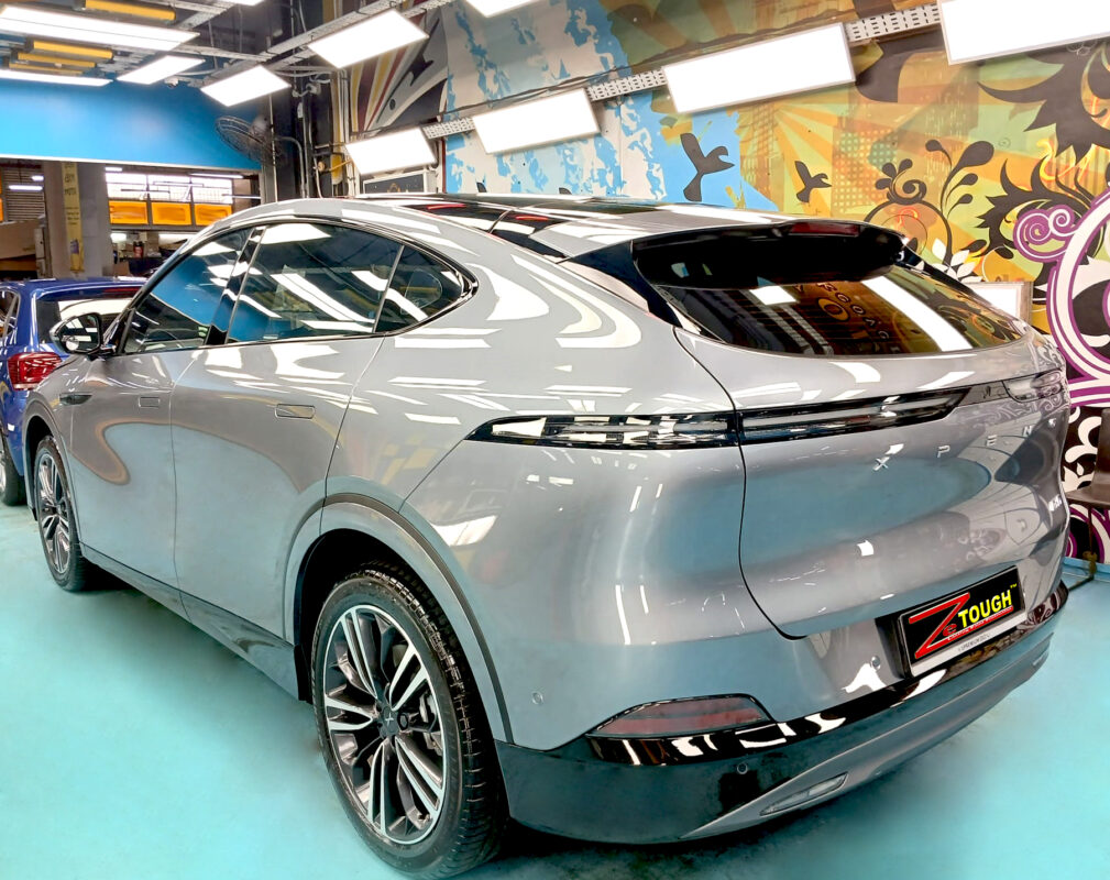 Rear quarter of the XPeng G6 RWD, glossy and protected.