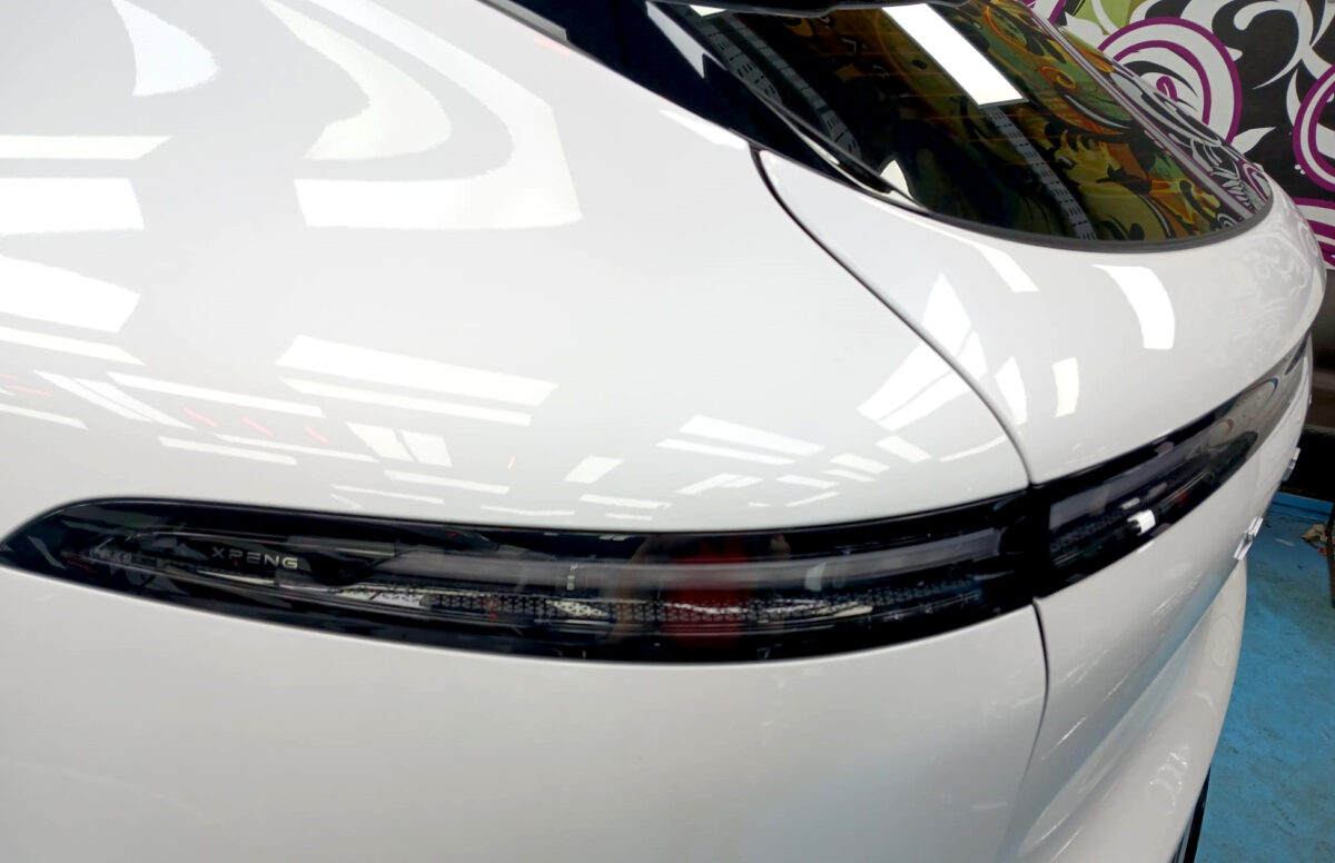 Rear quarter of the XPeng G6 RWD, glossy and protected.
