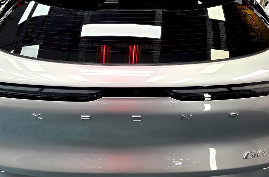 Xpeng lettering across the rear tailgate below the tail lamp.