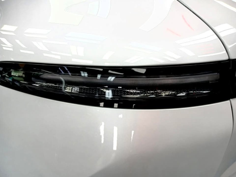 Close-up of the rear light strip and white rear quarter.