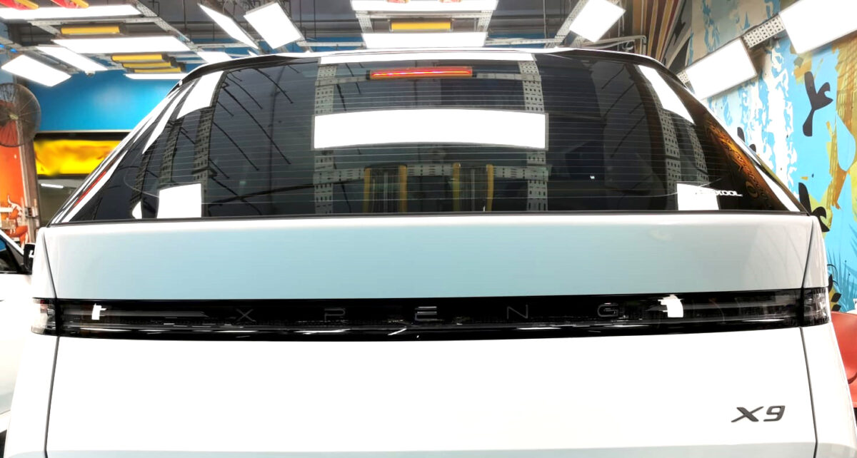 Rear quarter of the XPeng G9, glossy and protected.