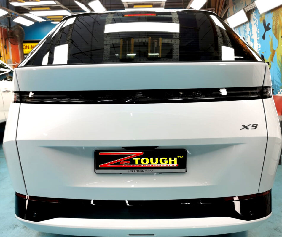 Rear quarter of the XPeng X9, glossy and protected.