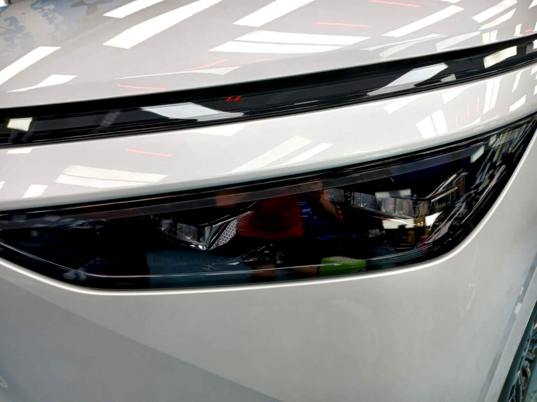 Wide angle of the XPeng X9 with the sealed paintwork.