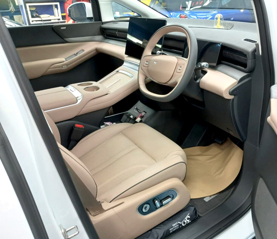 Side panel of the XPeng X9 reflecting clean lines after coating.