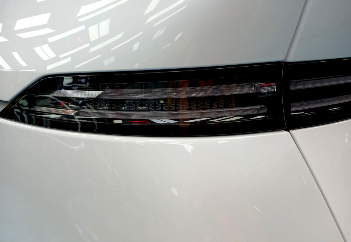 Rear quarter of the XPeng X9, glossy and protected.