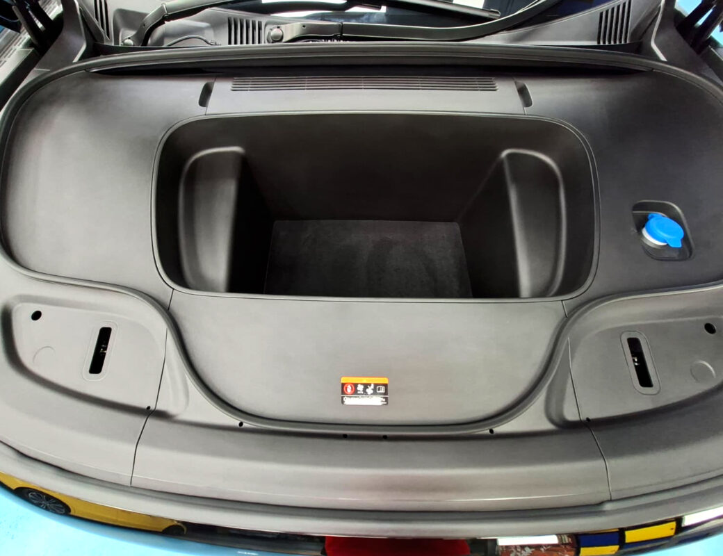 Reflections across the coated panels of the Zeekr 7X.