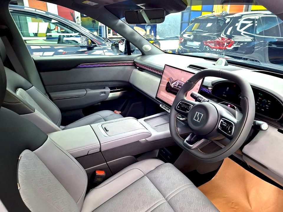 Interior of the Zeekr 7X with grey seats, steering wheel and centre screen.
