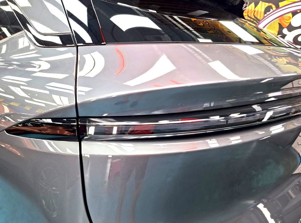 Close-up of the 7X tail light strip across the grey tailgate.