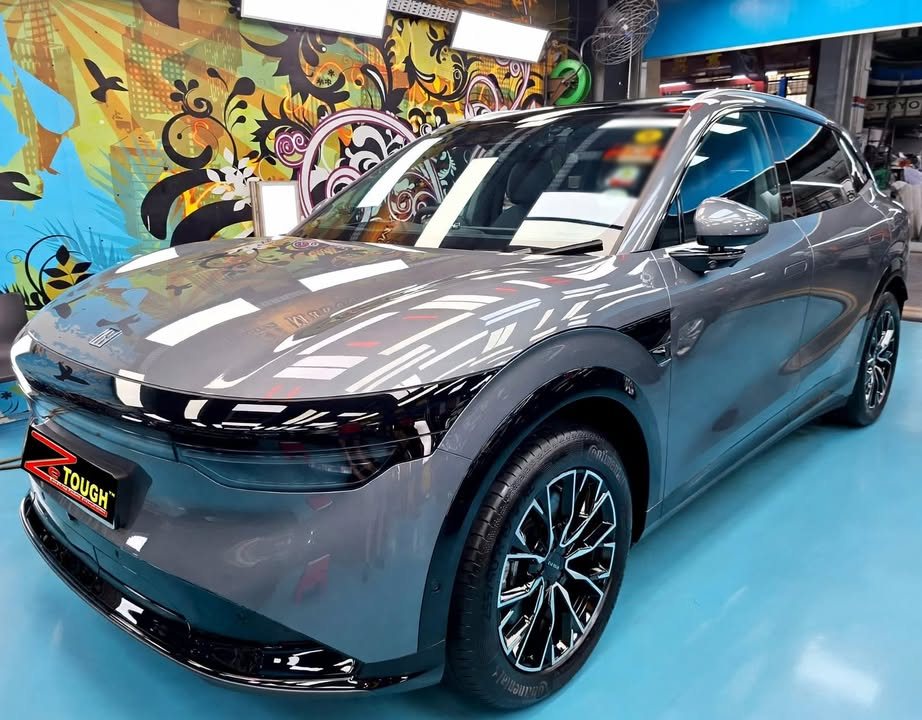 Grey Zeekr 7X, front three-quarter view, in the Revol Carz Makeover workshop after its ZeTough Ceramic coating.
