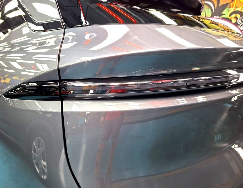 Close-up of the rear light bar and grey rear quarter panel.
