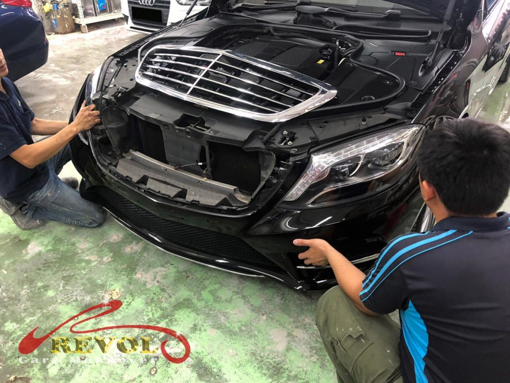 Revol Carz technicians preparing Mercedes for spray painting