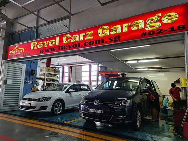 Revol Carz Garage Volkswagen specialist workshop entrance with two VW Golf being serviced