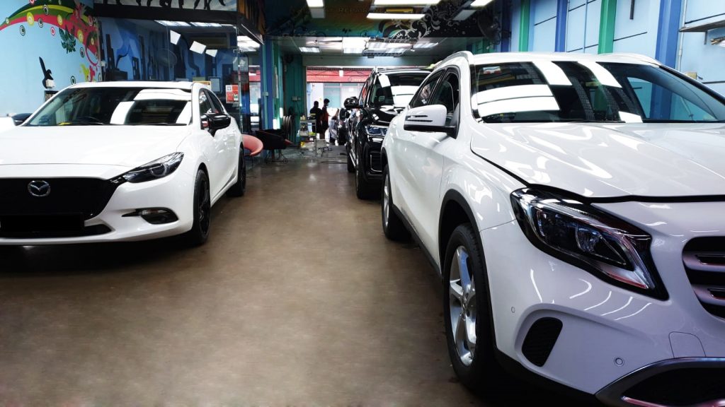 Packed with white and black cars at Toh Guan branch